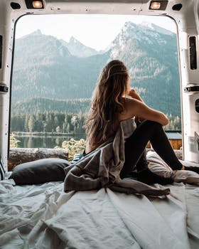 Woman enjoying camper van mattress view