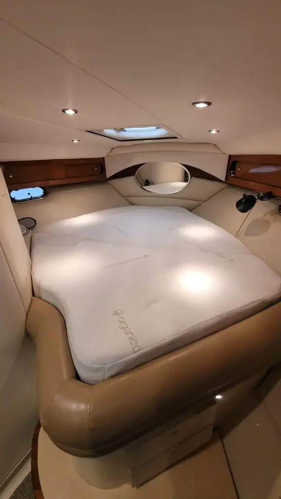 Custom boat mattress installed in yacht cabin berth