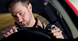 Drowsy driver fatigued behind wheel