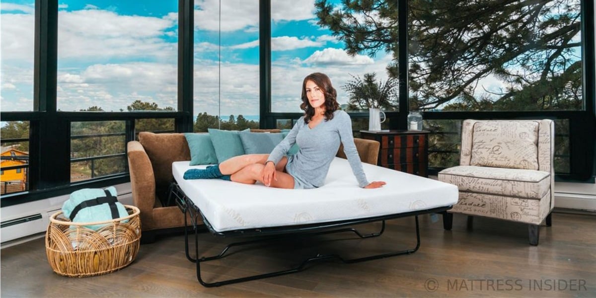 Model Sitting on Deluxe Sofa Bed Mattress with Memory Foam