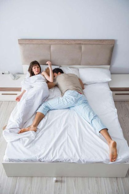 Couple sharing small bed